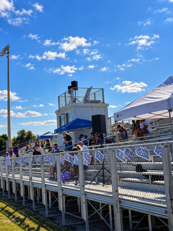 Speakers distributed around stadium seating to reach guests across a large outdoor area.
